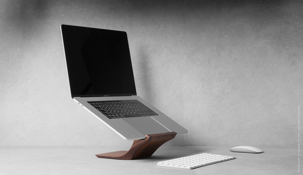 05 yohann product YB1WA macbook and macbook pro stand walnut wood angled side view with macbook pro wireless keyboard and mouse