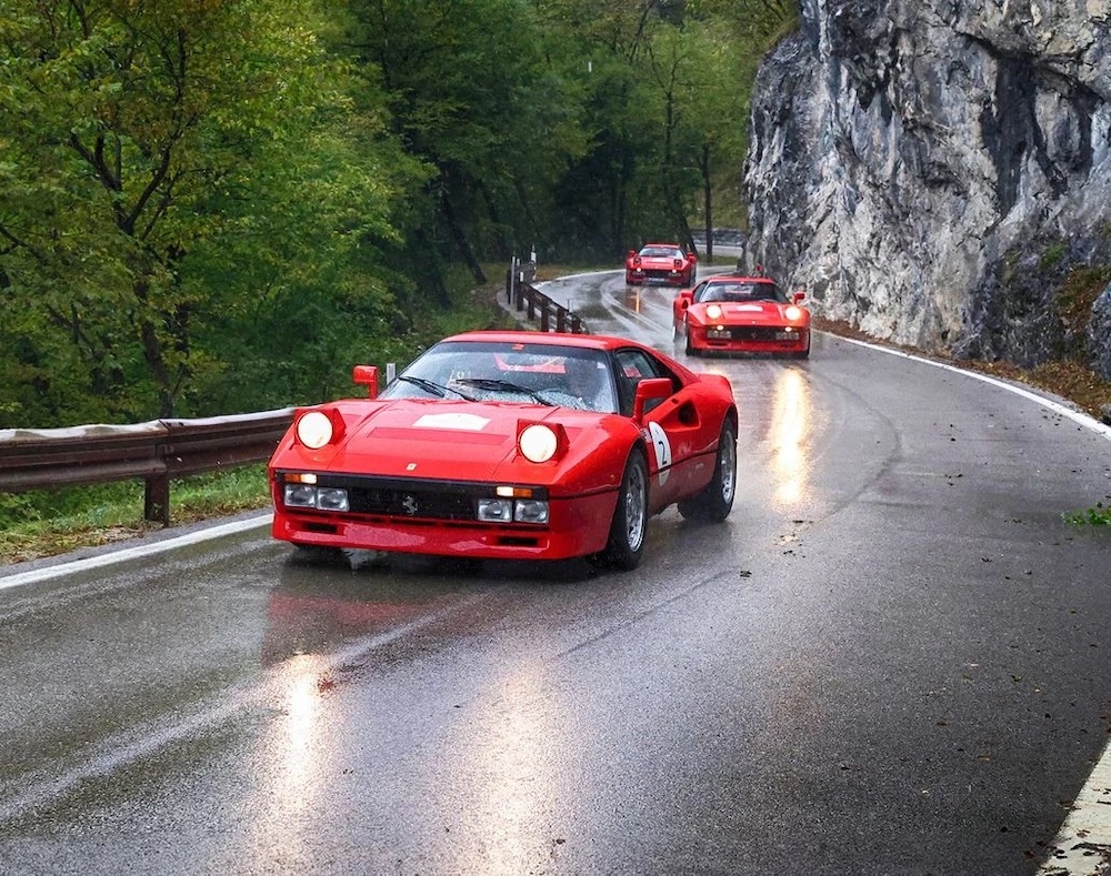 see the convoy of 25 GTO models taking on the stunning mountain passes of the Italian Dolomites…