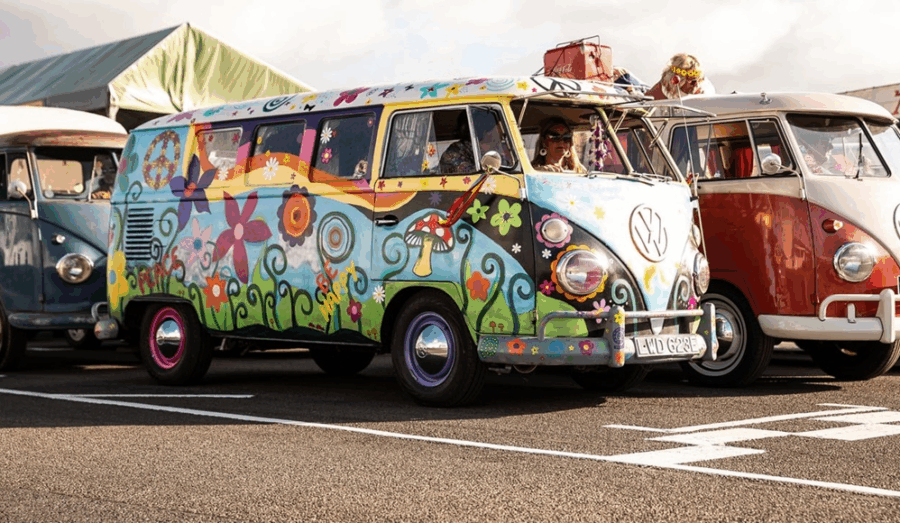 A Vibrant Parade Of VW Campers At Goodwood  Revival